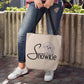 The Snowkie Tote Bag with a woman holding it in front of her legs